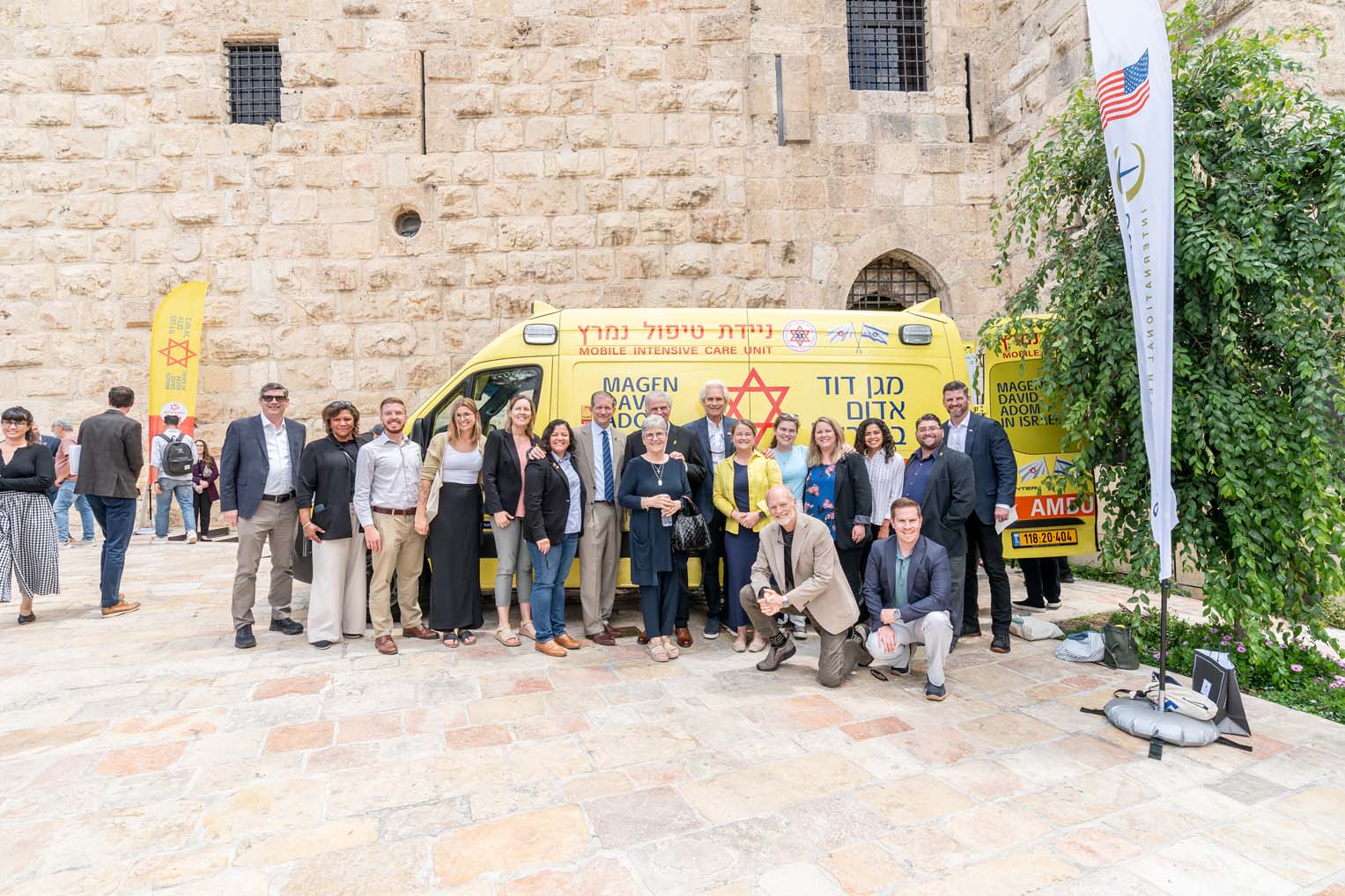 Group photo in front of new ambulance