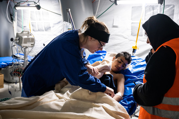 Medical staff caring for patient