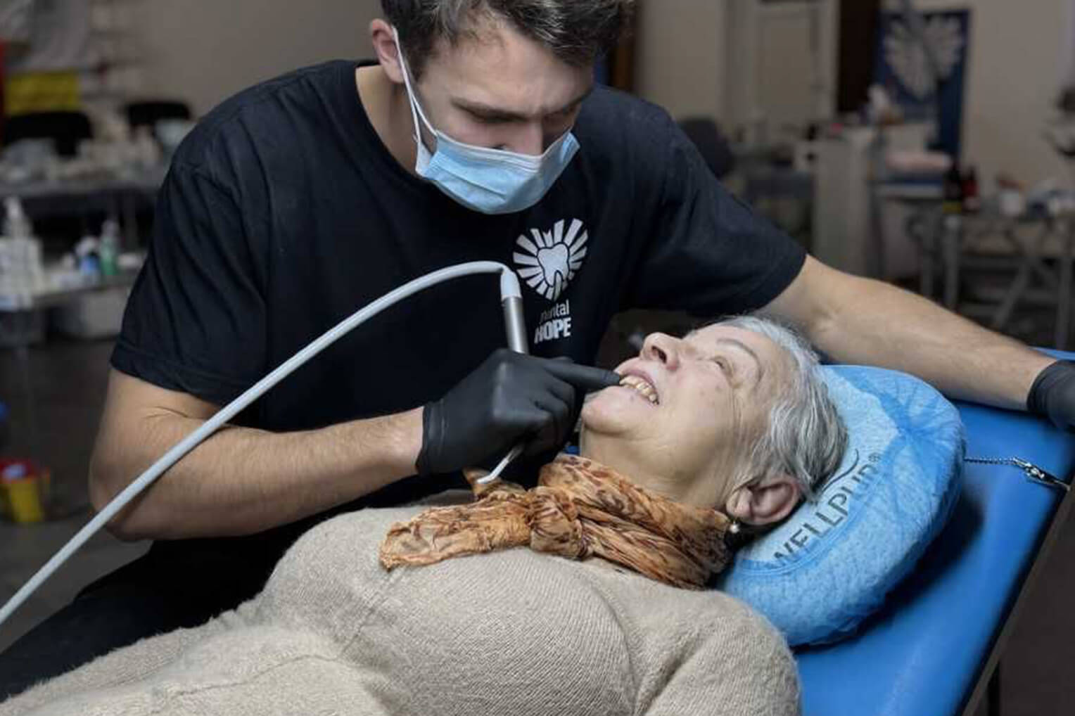 Dentist cleaning teeth